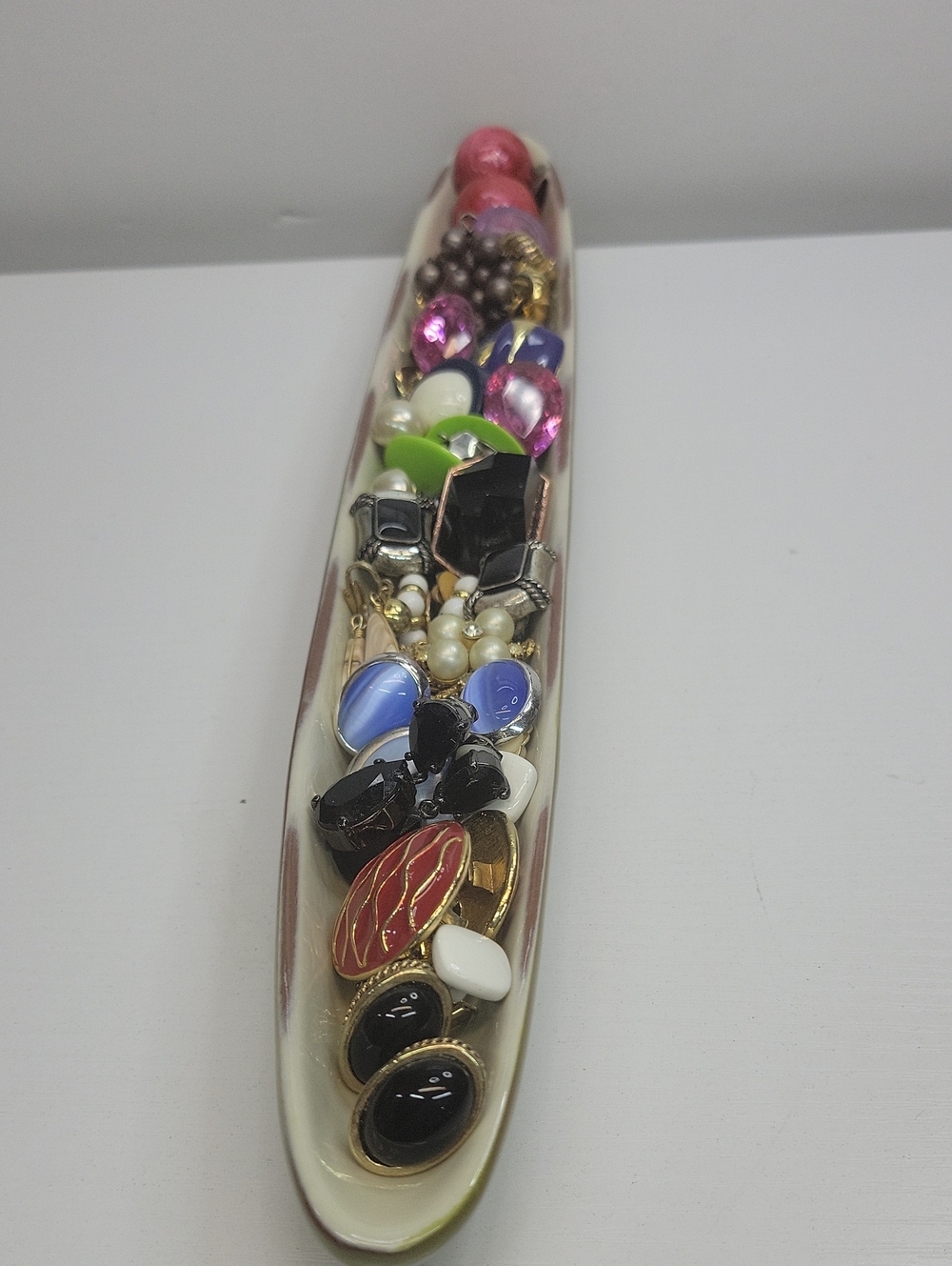 Long Dish Filled With Clip On Earrings
